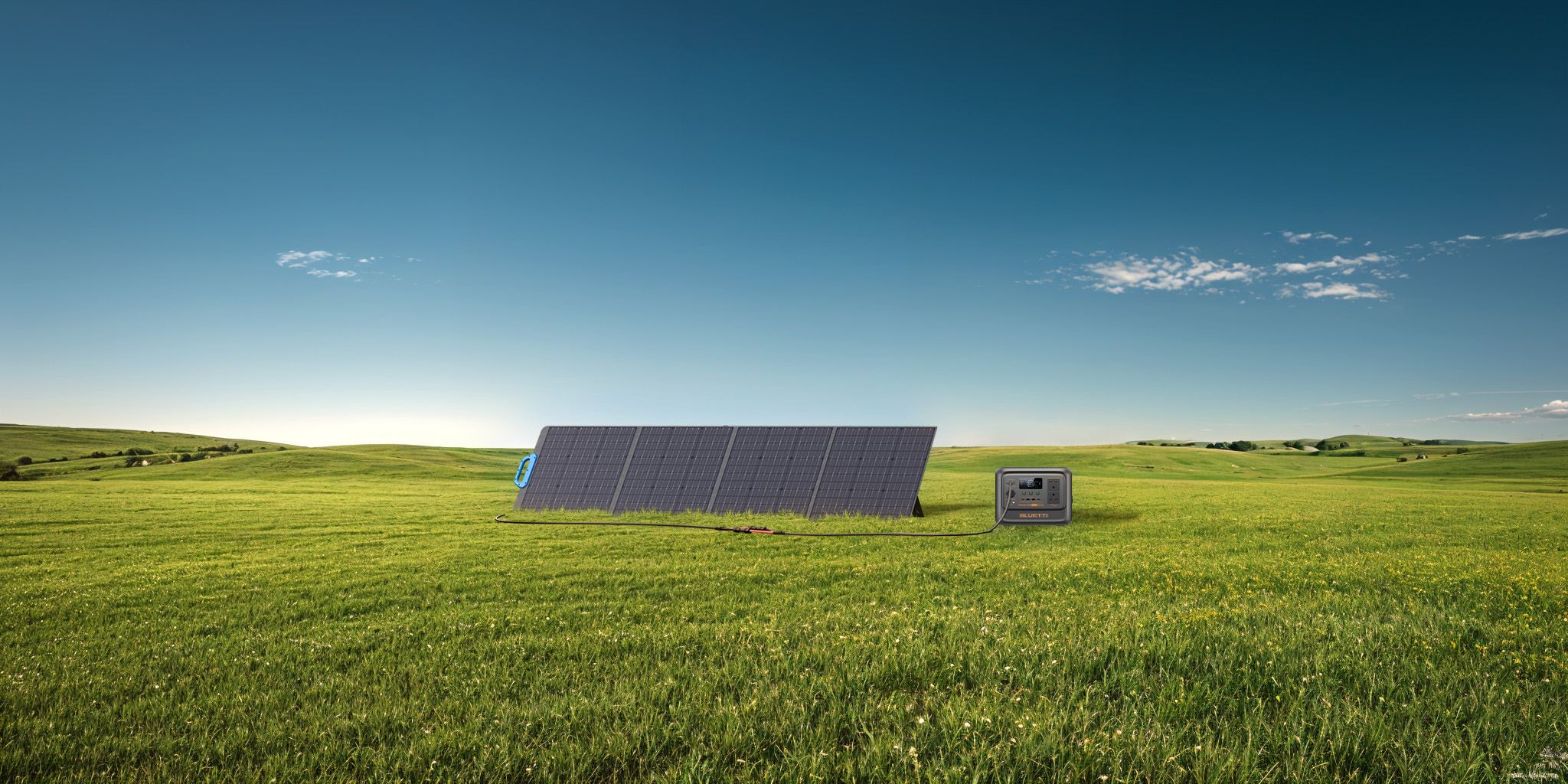 A BLUETTI portable power station charging from a folding solar panel in the field