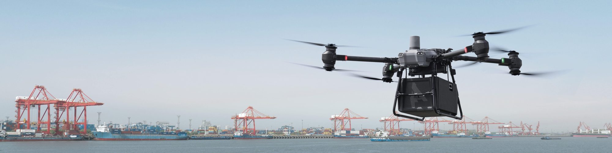 An enterprise drone in flight over a container terminal